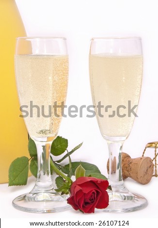 two cups of champagne with a rose redhead
