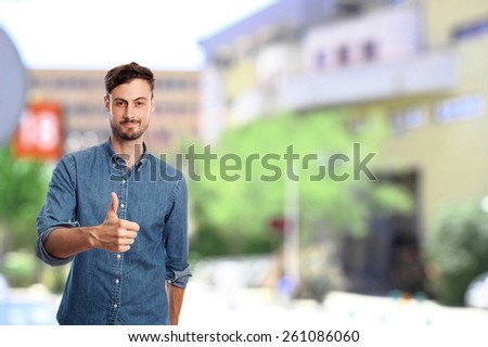 young cool man with okay gesture