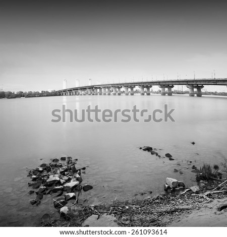 Bridge in Kiev, Ukraine. Daytime long exposure photo taken in black and white.