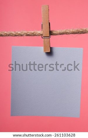 Blank paper notes hanging on rope with clothes pins, copy space for text or image or product placement. Reminder