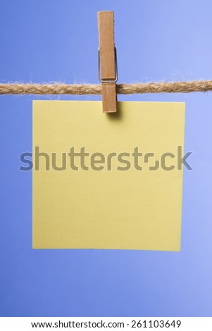 Blank paper notes hanging on rope with clothes pins, copy space for text or image or product placement. Reminder