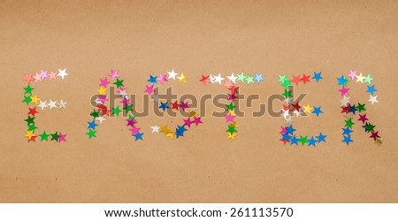 word easter made of colorful toy stars on kraft background