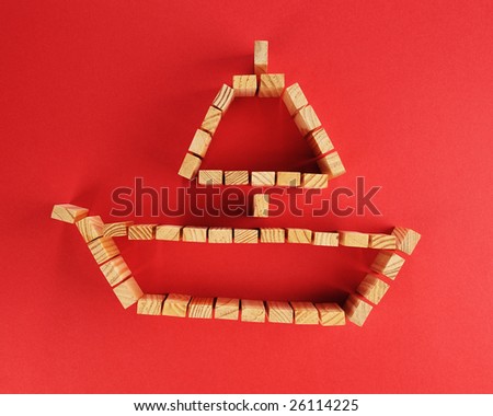 building blocks /A boat symbol isolated on a red background