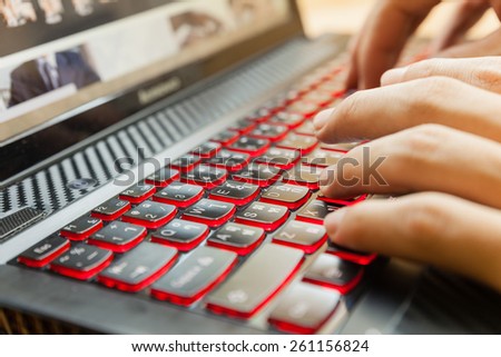 Close up of men hand during typing  the keyboard. Selective focus