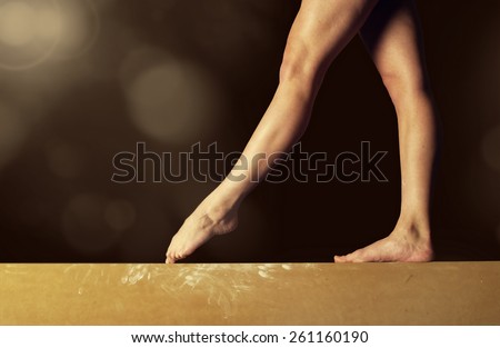 Close view of a Gymnast legs on a balance beam Royalty-Free Stock Photo #261160190