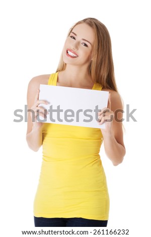 Happy woman holding white empty paper.