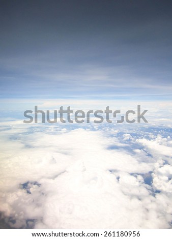 aerial view from window of  plane or aircraft which traveling air transportation .cloudy sky in clear day
