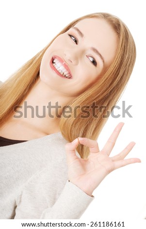 Portrait of a woman showing ok sign.