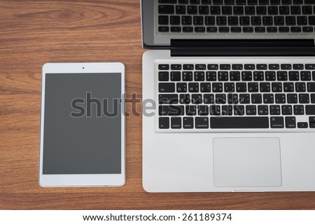 Laptop and on wood table