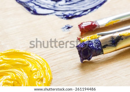 Palette with oil paint and palette knife, macro view.