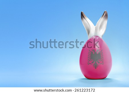 Colorful cute ceramic easter egg with rabbit ears and the flag of Albania .(series)