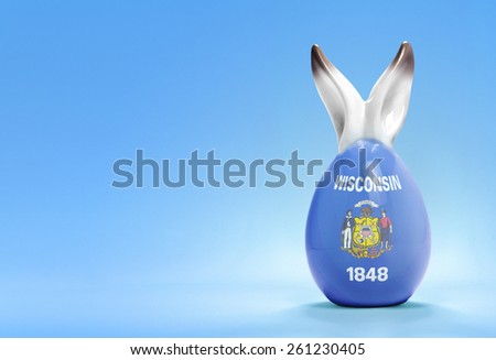 Colorful cute ceramic easter egg with rabbit ears and the flag of Wisconsin .(series)