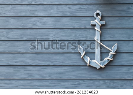 wooden anchor on wall background