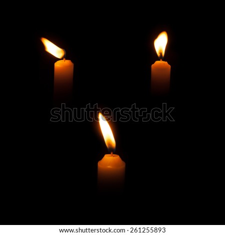 Candle flame set isolated over black background, collection of three images