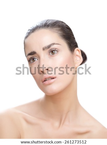 Young natural Caucasian woman with dark sleek hair.