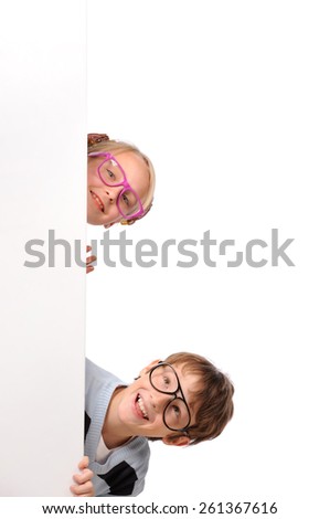 Portrait of happy children with white blank isolated on white background 
