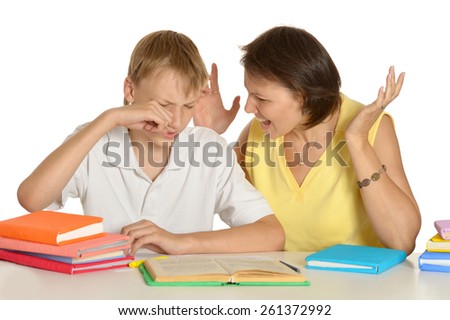 Mother is angry at her son doing homework