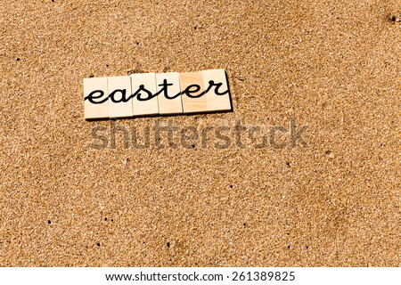 Words on sand. Words formed from small pieces of wood containing different letters with children Stroke.