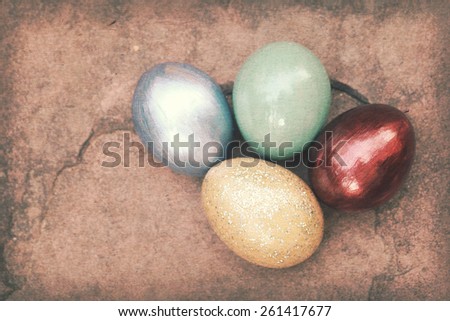 Vintage paper texture, Colorful easter eggs on stone floor.