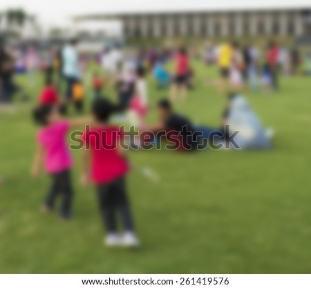 Defocused background of summer park with people.