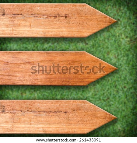 sign wooden board on grass