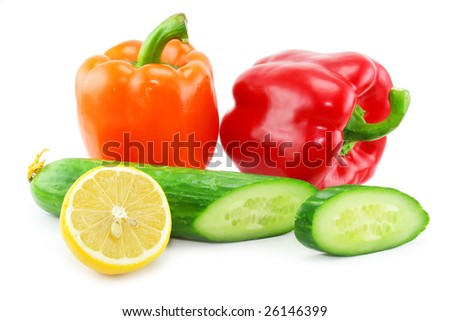 Fresh vegetables fruits (paprika, cucumber and lemon) isolated on a white background. Shot in a studio.