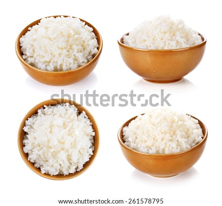 Rice in a bowl on a white background Royalty-Free Stock Photo #261578795