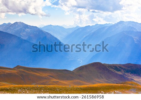 View of the mountain valley before sunset. Picture was taken during trekking hike in scenic mountains of northern Caucasia at autumn, Arhiz region, Abishira-Ahuba range, Karachay-Cherkessia, Russia