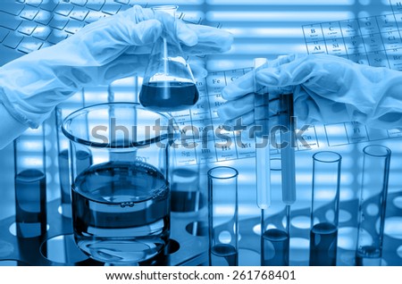 Chemical Laboratory,Hand holding the tube and test flask
