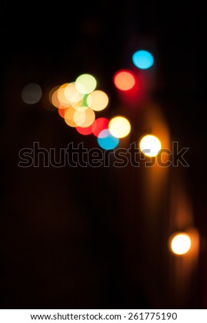 Colorful defocused bokeh lights background. Festive background with natural bokeh. Abstract blur background.