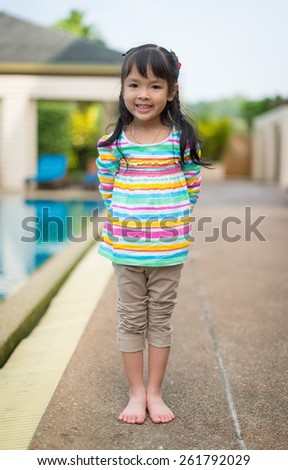 portrait of  little girl at pool