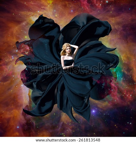 Black space queen. Beautiful woman in a fluttering dress flying in outer space. Fantastic art work. Elements of this image furnished by NASA
