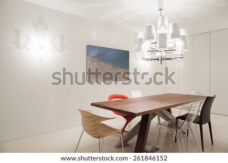 Designed pendant and chairs in modern dining room