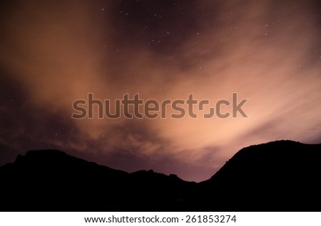 Many Stars in the Night Sky With Clouds