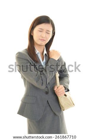 Business woman with shoulder pain.