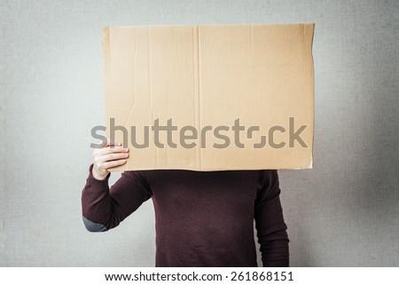 man holding an empty picture