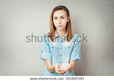 girl holding in his hands something invisible