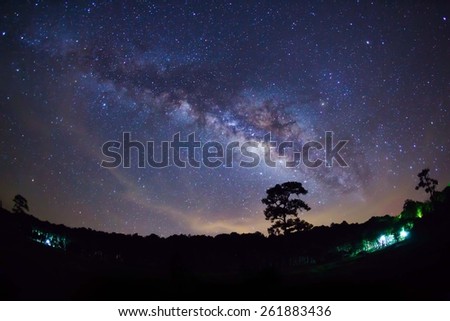 Silhouette of Tree with cloud and Milky Way at Phu Hin Rong Kla National Park,Phitsanulok Thailand. Long exposure photograph. Royalty-Free Stock Photo #261883436