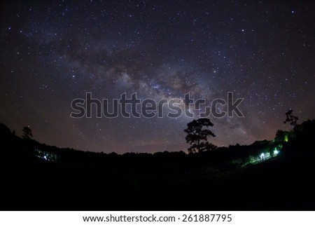 Silhouette of Tree with cloud and Milky Way at Phu Hin Rong Kla National Park,Phitsanulok Thailand. Long exposure photograph.