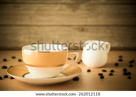 Coffee cup on wooden table Vintage Styled,Focus on Coffee Cup