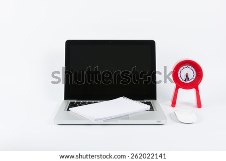 Laptop and red clock isolate on white background
