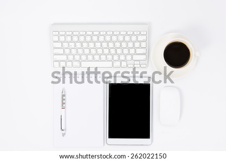 Business desk with a keyboard, mouse and pen on white table