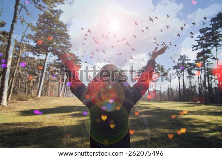 Young girl spreading hands with joy and inspiration facing the sun,sun greeting,freedom concept,bird flying above sign of freedom and liberty