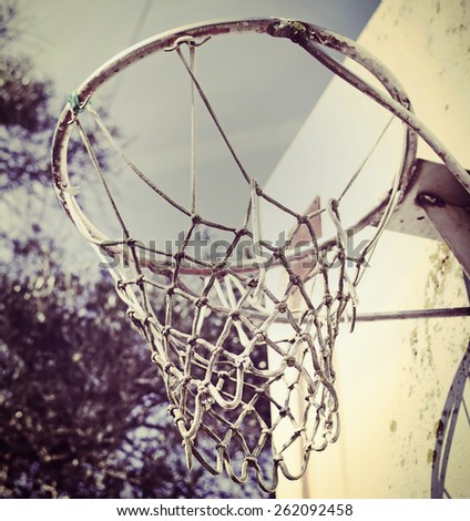 basketball hoop seen from below in vintage tone
