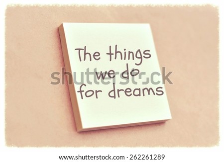 Text the things we do for dreams on the short note texture background
