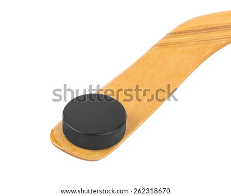 Ice hockey stick and puck isolated on white background