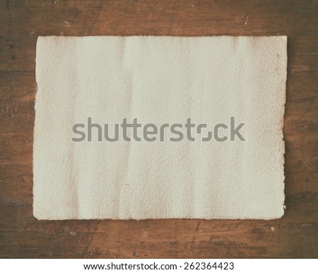 parchment on wooden desk.