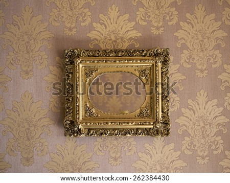 Wooden frame against a textured wall