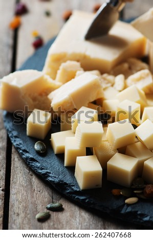 Various types of cheese on the table, selective focus