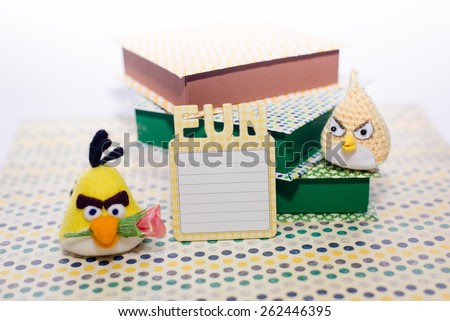 Picture of artistic birds and gift boxes or books on light copy space background